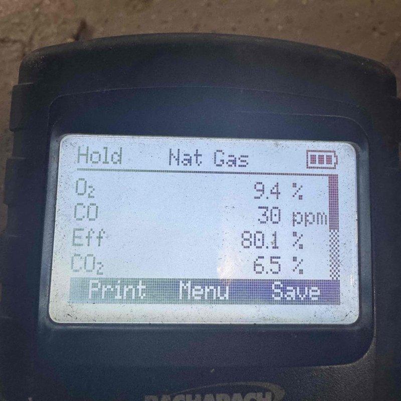 Completed periodic maintenance on six-year-old furnace system. Performed combustion analysis using digital gas analyzer, confirming safe operating parameters with oxygen level at 9.4%, carbon monoxide at 30 ppm, carbon dioxide at 6.5%, and combustion efficiency at 80.1%. Inspected air return vent and grille for proper airflow and verified system operation.