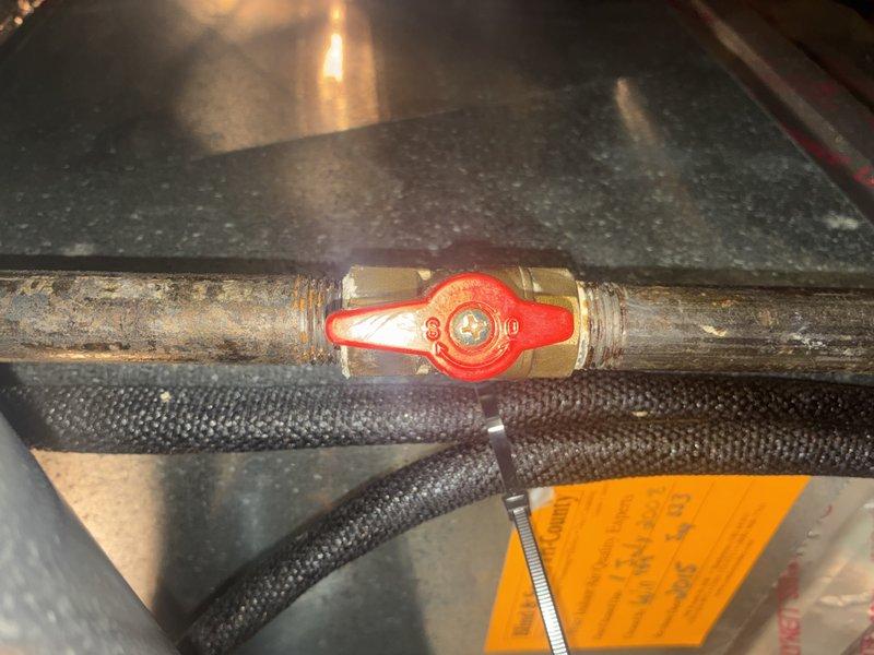 Completed scheduled heating maintenance visit. Inspected and serviced blower motor assembly, examining wear components including roller bushing and foam dampening material for proper operation. Assessed gas line valve and copper piping connections in attic space, noting existing patina on copper lines with valve operating properly.