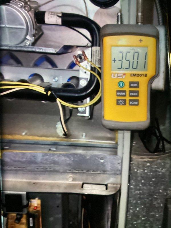 Completed scheduled MVP heating maintenance visit on gas furnace system. Performed combustion analysis using Bacharach analyzer, which confirmed proper burner operation with readings of 10.2% O₂, 14 ppm CO, 80.8% efficiency, and 6.1% CO₂. Measured static pressure at +350.1 using UEi digital manometer to verify proper airflow through the system. All measurements within acceptable operating parameters. System operating safely and efficiently.