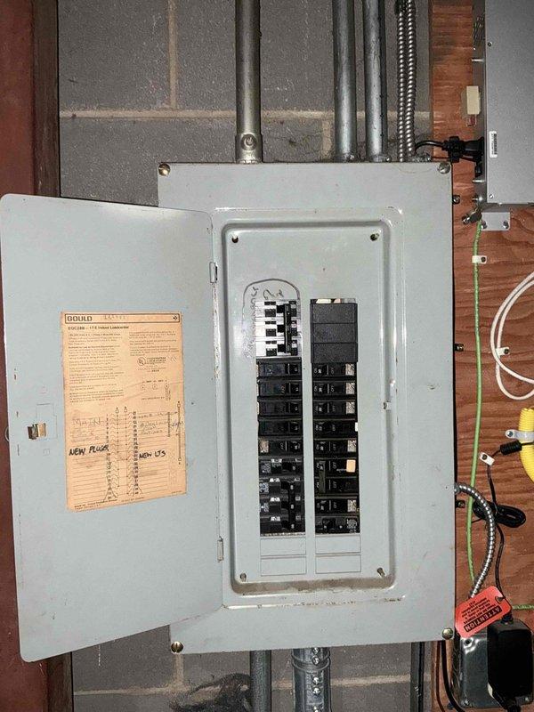 Conducted on-site assessment for mini split installation in office building waiting room and lobby area. Evaluated existing electrical infrastructure including main breaker panel in utility area to determine capacity for new HVAC system. Documented space layout, ceiling configuration with acoustic tiles and recessed lighting, and photographed electrical service panel to verify available circuits and amperage for equipment installation.