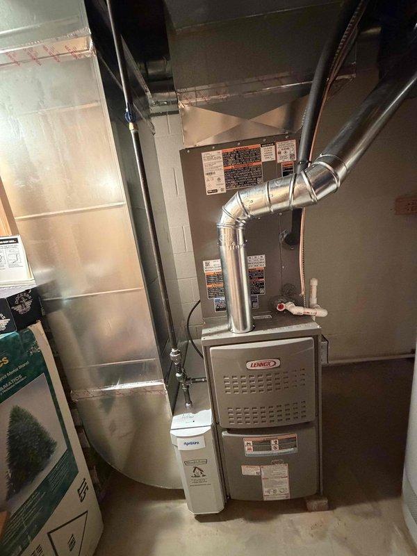 Completed full HVAC system installation including an 80% efficiency Lennox furnace and air conditioning unit in basement utility area. Installed Aprilaire humidifier for whole-home humidity control, connected all ductwork to existing infrastructure, and ensured proper venting with PVC piping. All electrical connections completed to code, system tested and verified operational.