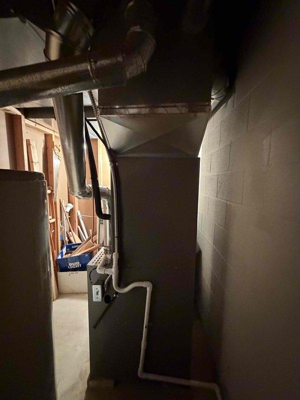 Completed full HVAC system installation including an 80% efficiency Lennox furnace and air conditioning unit in basement utility area. Installed Aprilaire humidifier for whole-home humidity control, connected all ductwork to existing infrastructure, and ensured proper venting with PVC piping. All electrical connections completed to code, system tested and verified operational.