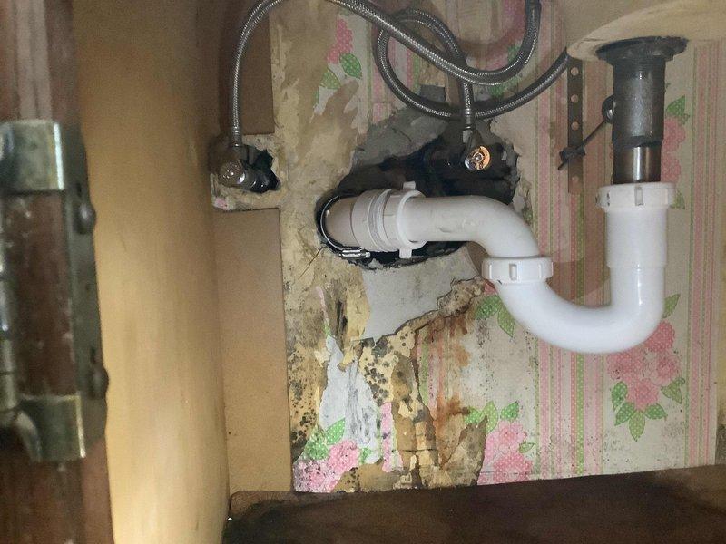 Replaced existing lavatory faucet with new Moen Chateau chrome trim faucet in hall bathroom. Modified galvanized drain nipple in cabinet and installed mission band to properly adapt to new trap assembly. Replaced corroded brass nipples and installed new FIP angle stops on both hot and cold water supply lines, as the cold side was previously missing an angle stop and the hot side stop showed severe corrosion. All connections tested and verified leak-free upon completion.