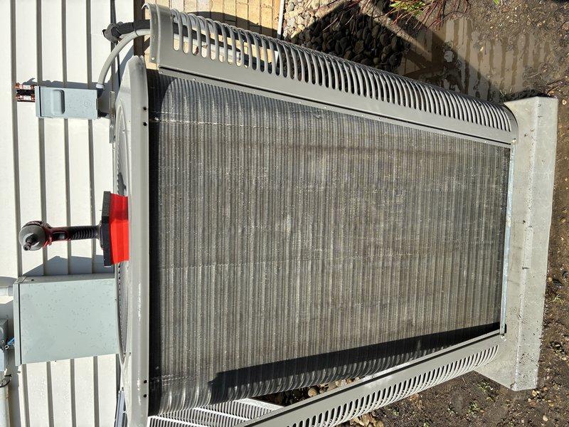 Completed routine BS-MVP cooling maintenance visit on residential HVAC system. Performed comprehensive inspection of evaporator coil assembly and condenser unit, documenting component condition through photographic records. Evaporator coil showed normal operational wear with intact refrigerant line connections and proper brazed joints. Condenser unit exterior exhibited typical outdoor exposure patterns with coil fins and frame in serviceable condition. All major components including heat exchanger surfaces, refrigerant lines, and mounting hardware were verified as functional with no immediate service needs identified.