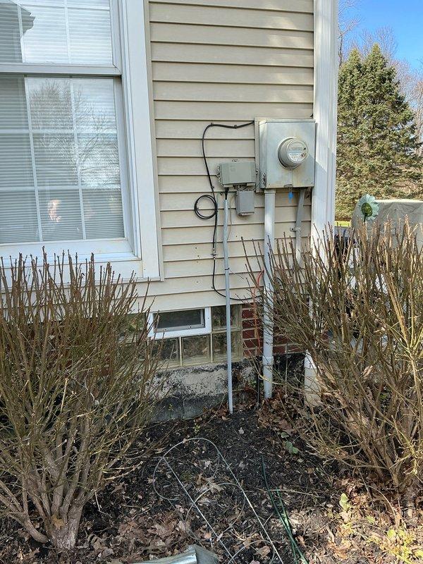 Conducted on-site evaluation for residential backup generator installation. Assessed existing electrical service configuration, including main meter location, service disconnect, and main electrical panel in basement utility area. Documented current electrical infrastructure, panel capacity, and optimal placement for transfer switch installation. Evaluated exterior mounting location adjacent to existing meter base for generator pad placement and utility connections. Photographed electrical service equipment and panel configuration to develop comprehensive material list and installation scope for automatic standby generator system.