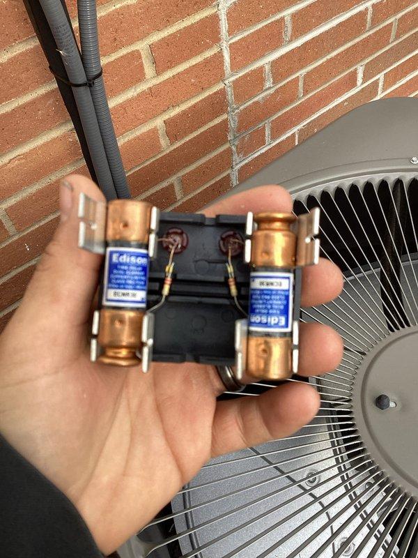 Completed Early Bird tune-up on Lennox outdoor air conditioning unit. Performed comprehensive system inspection, verified dual fuse assembly with Edison brand fuses in proper working condition, and confirmed all electrical components secure and functioning. Unit operating within normal parameters with no issues identified during service visit.