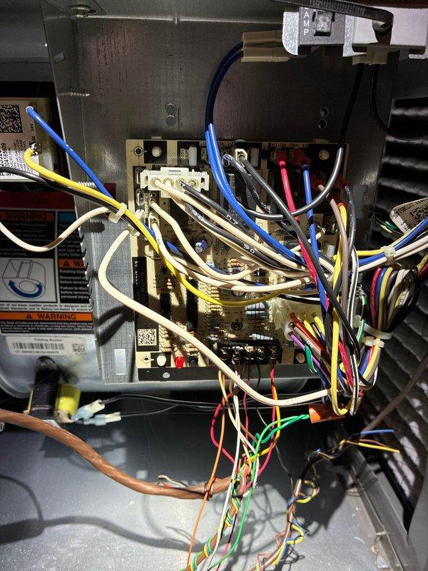 Completed comprehensive AC tune-up and maintenance inspection on residential air conditioning system. Performed visual inspection of air handler unit, examining electrical control panel and wiring connections for proper operation and safety compliance. Inspected return air filter, noting accumulated debris and particulate matter trapped in filter media, indicating normal filtration function. Checked all electrical connections, terminal blocks, and relay components within control panel for secure mounting and proper wire routing. Verified all safety labels and warning placards remain legible and in place. System operational and ready for cooling season.