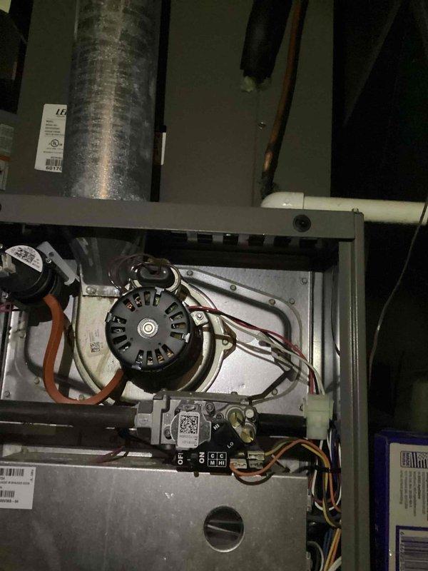 Responded to no heat call on 9-year-old natural gas furnace. Customer reported thermostat temperature dropping despite furnace console displaying 70°F, with audible ignition attempts but no successful startup. Upon inspection, accessed furnace cabinet and examined blower motor assembly, electrical connections, and gas valve components. Verified all wire terminations at motor and control board were secure. Inspected inducer motor operation and venting system for proper draft. Checked gas valve for proper voltage supply and confirmed gas line pressure. Tested ignition sequence and flame sensor operation. Identified issue preventing successful ignition cycle. Cleaned flame sensor rod and verified proper microamp reading. Cycled system multiple times to confirm reliable ignition and sustained operation. Verified proper airflow through heat exchanger and ductwork connections. System restored to normal heating operation with thermostat responding appropriately to temperature calls.