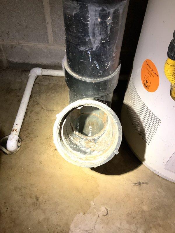 Responded to service call for main drain line blockage. Upon arrival, accessed cleanout in basement utility area and assessed drainage system. Customer reported suspected clog in main line before connection to street. Performed initial inspection of accessible drain lines and cleanout access points. Documented existing plumbing configuration including PVC drainage system and basement utility setup for potential camera inspection if blockage persists or recurs.