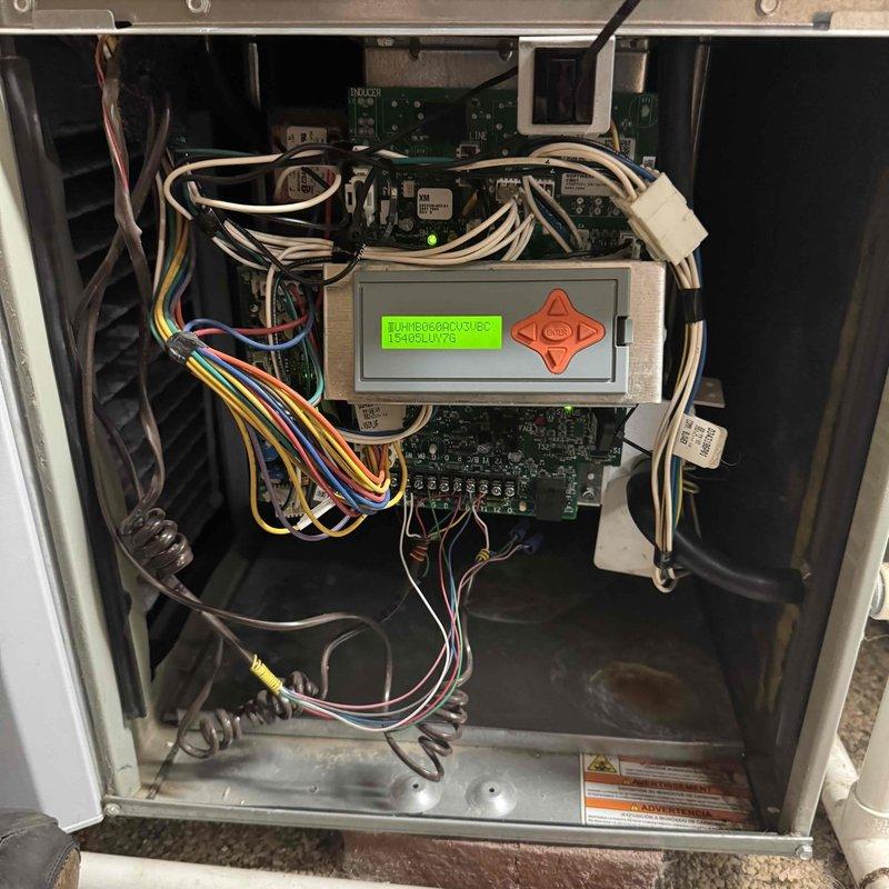 # HVAC Service Call - No Heat Condition

Responded to no heat call on 10-year-old furnace system. Upon arrival, confirmed unit was not producing heat. Removed access panel and performed visual inspection of internal components and control systems.

Examined blower assembly, motor connections, and electrical wiring throughout the unit. All wire connections appeared secure with no visible signs of damage or loose terminals. Inspected control board circuitry and digital display interface, which was operational and showing diagnostic information. 

Evaluated pressure switches, safety sensors, and flame sensing components for proper operation. Checked all visible safety interlocks and control sequences. Reviewed system configuration on digital control panel to verify proper programming and thermostat communication.

Inspected heat exchanger area and internal airflow pathways for obstructions or damage. Blower wheel showed no signs of debris accumulation that would restrict airflow. All mech