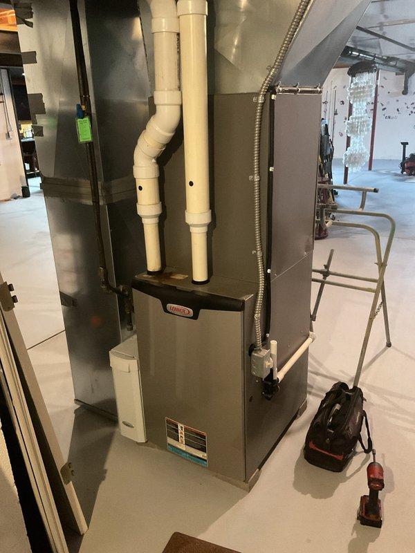 Completed recurring maintenance service on both the outdoor condensing unit and indoor furnace system, both approximately 7 years old. Performed comprehensive inspection of the outdoor AC unit including examination of the compressor, condenser coil, refrigerant lines, and electrical connections. Verified proper operation of the indoor furnace unit, inspected all PVC venting and drainage systems, and confirmed all components were functioning within normal parameters. Both systems are operating efficiently with no immediate service needs identified.