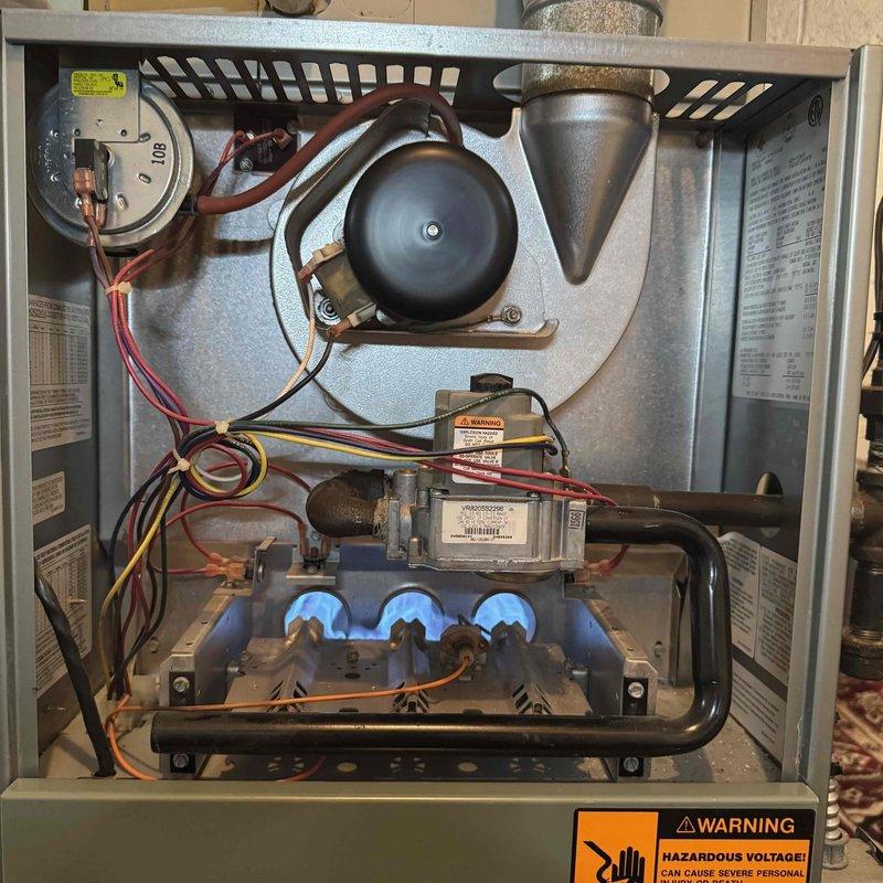 Completed scheduled MVP heating maintenance visit on 22-year-old furnace system. Performed comprehensive inspection of all major components including blower assembly, draft inducer motor, burner assembly, gas valve, and control module. Verified proper operation of ignition system and flame sensors, confirmed all electrical connections were secure, and documented unit condition through photographic records. All systems operating within normal parameters at time of service.