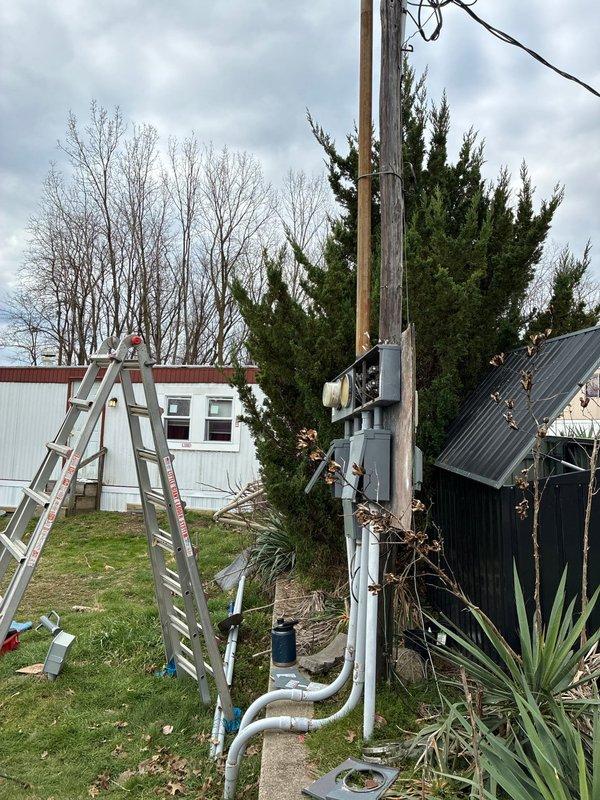 Removed existing 4-meter base combo assembly and three associated disconnects from the property. Retained and reconnected the disconnect labeled as unit 24. Installed new meter base and riser assembly, establishing proper connection to overhead power lines. Successfully re-energized the remaining disconnect, restoring electrical service to the structure.