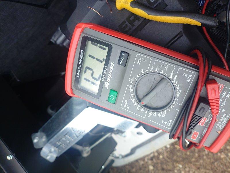 Responded to service call for recently installed Generac generator displaying multiple fault codes including engine fuel alarm, CANbus error alarm, and low battery voltage alarm preventing unit operation. Upon arrival, performed diagnostic testing using digital multimeter to assess battery condition. Measured battery voltage at 13.45 volts under static conditions, which falls below the manufacturer's minimum threshold required for proper generator operation and control system functionality. Low battery voltage was determined to be the primary cause of the cascading fault conditions, as insufficient power to the control board resulted in CANbus communication errors and false fuel system alarms. Advised that battery requires charging or replacement to restore generator to operational status and clear all associated fault codes from the MobilLink monitoring system.
