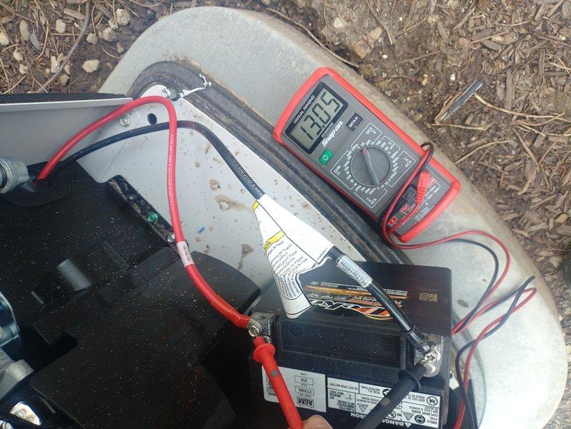 Responded to service call for recently installed Generac generator displaying multiple fault codes including engine fuel alarm, CANbus error alarm, and low battery voltage alarm preventing unit operation. Upon arrival, performed diagnostic testing using digital multimeter to assess battery condition. Measured battery voltage at 13.45 volts under static conditions, which falls below the manufacturer's minimum threshold required for proper generator operation and control system functionality. Low battery voltage was determined to be the primary cause of the cascading fault conditions, as insufficient power to the control board resulted in CANbus communication errors and false fuel system alarms. Advised that battery requires charging or replacement to restore generator to operational status and clear all associated fault codes from the MobilLink monitoring system.