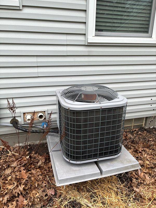 Completed MVP recurring cooling maintenance visit on residential air conditioning system. Performed comprehensive inspection of outdoor condensing unit, verified proper fan operation, and examined electrical disconnect box. Inspected fuses and electrical connections, noting accumulated debris and aging components within disconnect enclosure. Unit operational at time of service completion.