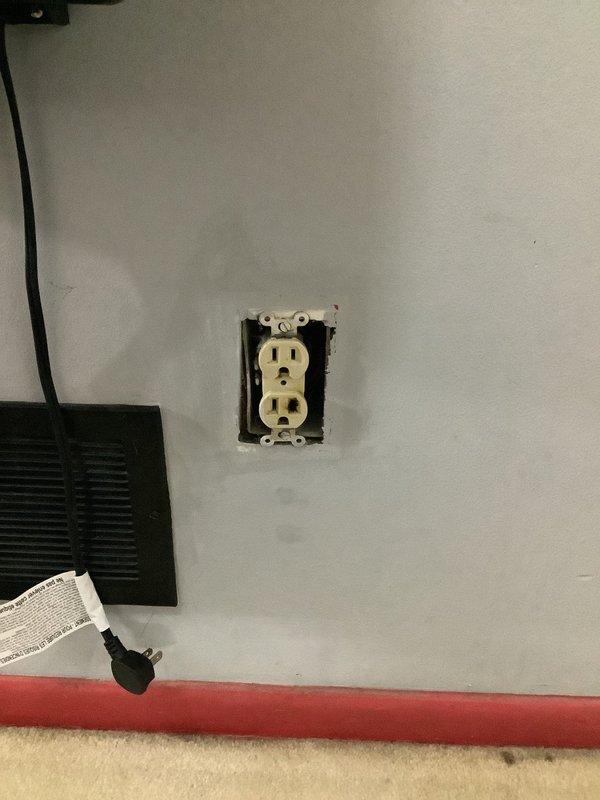 Removed two existing wall switches per customer request and installed customer-supplied smart outlet in residential location. Replaced standard duplex receptacle with programmable smart outlet featuring timer controls and indicator lights, verified proper wiring connections and tested device functionality to ensure proper operation.