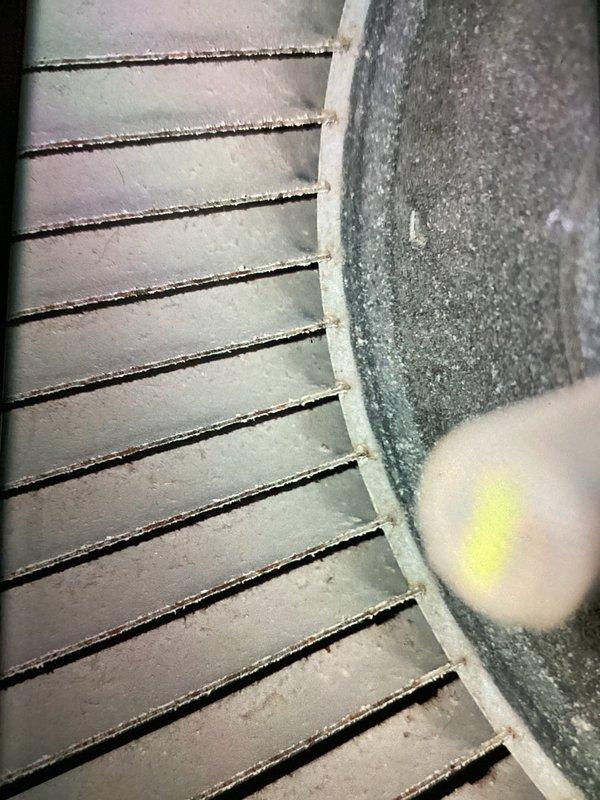 Completed scheduled MVP maintenance visit on a 5-year-old residential heating system. Performed comprehensive inspection of furnace unit, including examination of heat exchanger fins which showed moderate dust accumulation, and blower assembly components. Documented system condition through photography, noting proper PVC venting installation and overall equipment functionality. System operating within normal parameters at time of service.