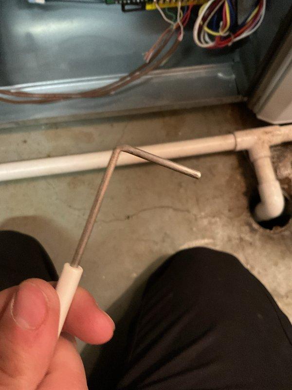 Completed annual MVP heating maintenance visit on one-year-old system. During inspection, discovered kinked copper refrigerant line requiring documentation and assessment. Performed electrical diagnostics using clamp meter to verify system amperage and confirm proper electrical operation of heating components. Documented damaged copper tubing with angular bend that may impact system efficiency and refrigerant flow. Verified all electrical connections and measured current draw to ensure equipment operating within manufacturer specifications.