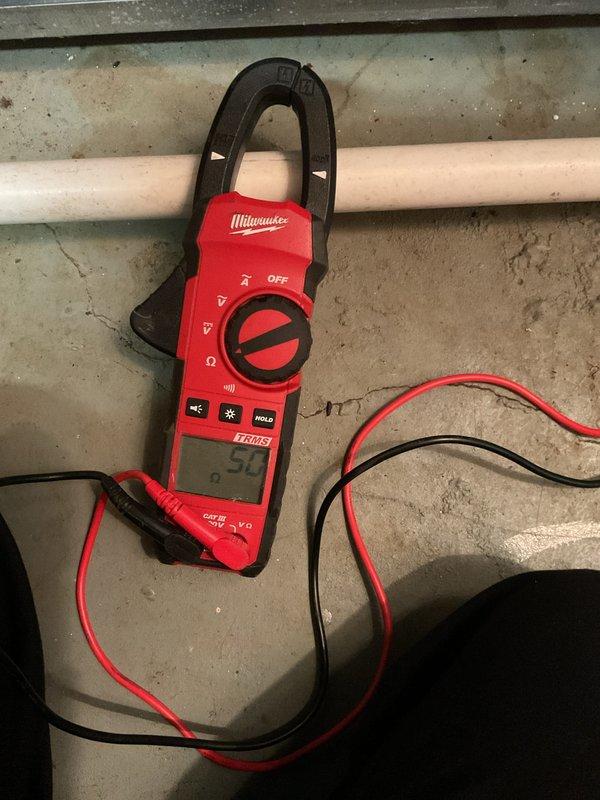 Completed annual MVP heating maintenance visit on one-year-old system. During inspection, discovered kinked copper refrigerant line requiring documentation and assessment. Performed electrical diagnostics using clamp meter to verify system amperage and confirm proper electrical operation of heating components. Documented damaged copper tubing with angular bend that may impact system efficiency and refrigerant flow. Verified all electrical connections and measured current draw to ensure equipment operating within manufacturer specifications.