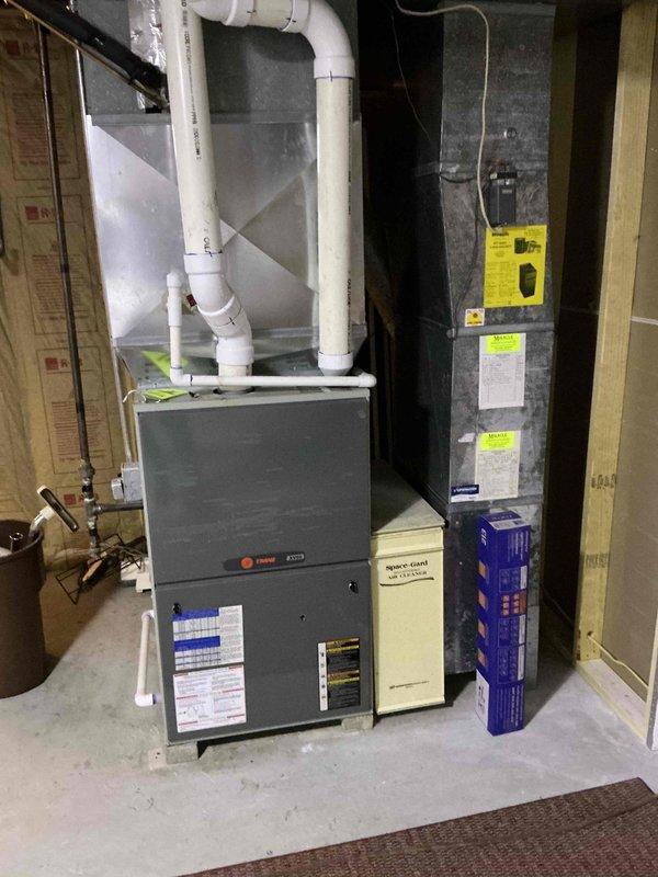 Performed on-site estimate for furnace replacement due to cracked heat exchanger in 17-year-old unit. Assessed existing HVAC system configuration in basement mechanical room, documented equipment condition with photographs, and provided quote for complete furnace replacement with new high-efficiency unit and associated components including PVC venting system.