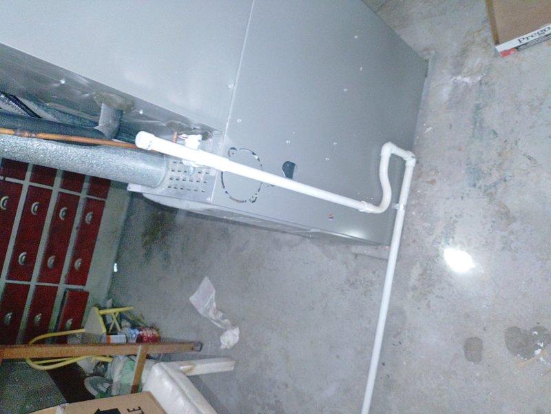 Responded to no-heat call where thermostat was not reaching setpoint. Upon arrival, performed diagnostic inspection of furnace system and verified all mechanical components, ductwork connections, and control systems were functioning properly. Documented equipment condition with photos showing air handler unit, PVC venting system with proper insulation, and associated mechanical room infrastructure all in operational status.