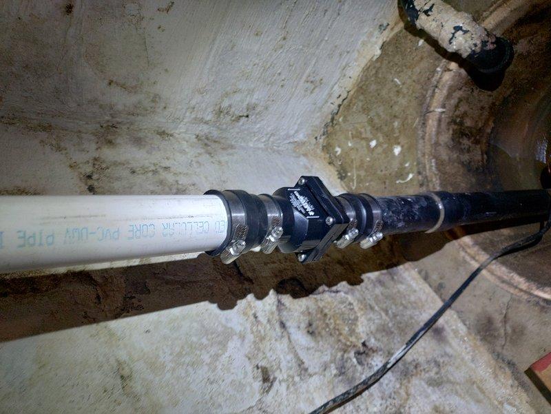 Completed new sump pump installation in forty-year-old residential property. Installed discharge piping system utilizing Schedule 40 PVC-DWV cellular core pipe with proper fittings and connections to existing plumbing infrastructure. Secured all piping with metal clamps and mounting hardware against basement foundation walls. Connected electrical wiring with appropriate wire nuts and ensured proper grounding for pump operation. System tested and verified for proper discharge flow and operational functionality.