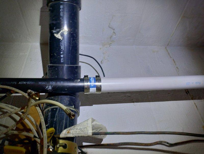 Completed new sump pump installation in forty-year-old residential property. Installed discharge piping system utilizing Schedule 40 PVC-DWV cellular core pipe with proper fittings and connections to existing plumbing infrastructure. Secured all piping with metal clamps and mounting hardware against basement foundation walls. Connected electrical wiring with appropriate wire nuts and ensured proper grounding for pump operation. System tested and verified for proper discharge flow and operational functionality.