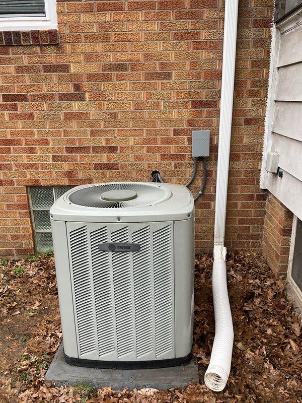 Completed routine preventive maintenance visit on residential cooling system for MVP customer. Inspected outdoor condenser unit and coil assembly, noting accumulated debris and seasonal leaf buildup around equipment requiring attention for optimal airflow and system efficiency. Verified electrical connections, disconnect box functionality, and condensate drain line operation with all components found in serviceable condition.