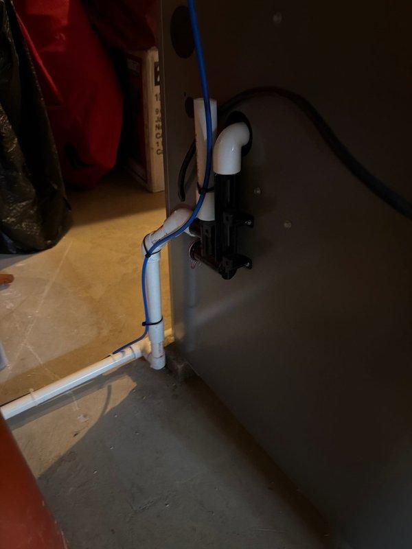 Completed full HVAC system installation including two Lennox air conditioning units mounted on rubber pads with proper electrical disconnects and conduit routing, along with furnace installation at 90% efficiency. Installed condensate pump system with PVC drainage piping to handle water removal from the heating and cooling equipment.