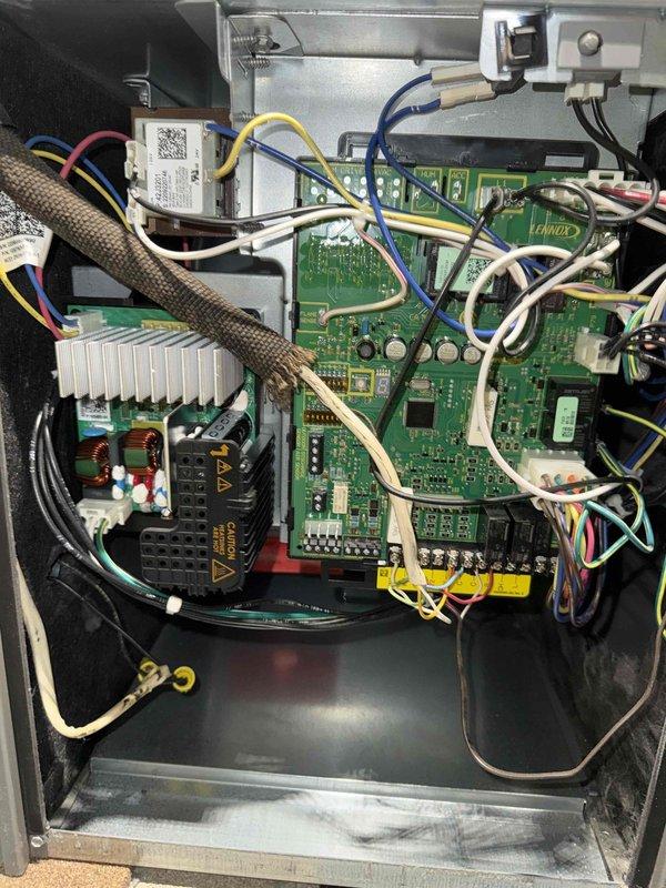 Completed scheduled BS-MVP cooling maintenance visit on HVAC system. Performed comprehensive inspection of control board assembly, documenting internal circuitry, wiring connections, and electronic components including PCB with integrated circuits, capacitors, and DIP switch configurations. Verified proper operation of all system controls and photographed control panel interior showing heat sink assembly, power supply unit, and sensor connections for maintenance records.