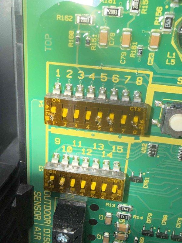 Completed scheduled BS-MVP cooling maintenance visit on HVAC system. Performed comprehensive inspection of control board assembly, documenting internal circuitry, wiring connections, and electronic components including PCB with integrated circuits, capacitors, and DIP switch configurations. Verified proper operation of all system controls and photographed control panel interior showing heat sink assembly, power supply unit, and sensor connections for maintenance records.