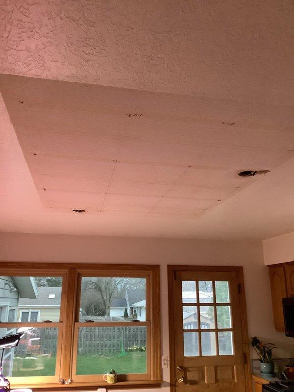 Responded to kitchen light fixture issue in residential property. Upon inspection, identified electrical concerns with existing ceiling-mounted fixture. Assessed ceiling conditions and electrical connections, noting ceiling damage requiring attention for proper fixture installation. Evaluated electrical outlet functionality and overall circuit integrity in the work area. Discussed service options and membership program benefits with homeowner for ongoing electrical maintenance needs.