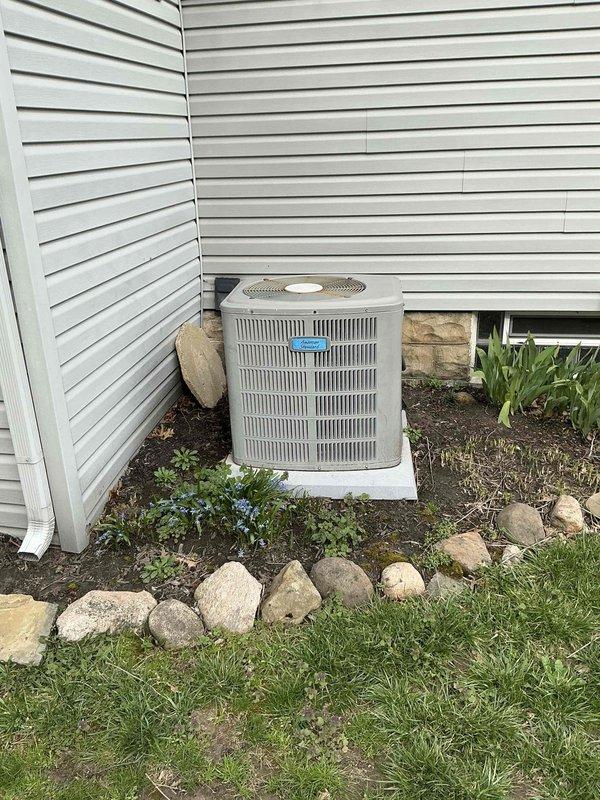 Completed comprehensive assessment for furnace replacement on 26-year-old heating system that had reached end of serviceable life. Evaluated existing HVAC equipment including outdoor condensing unit positioned on concrete pad with proper landscaping clearances and basement furnace installation with associated ductwork and plenum assembly. Documented current system configuration, gas line routing, and existing duct connections to prepare detailed replacement quote for new high-efficiency heating equipment.