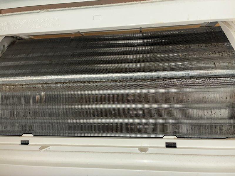 Completed comprehensive cooling maintenance and tune-up on a 9-year-old air conditioning system. Performed thorough inspection of evaporator coils, which showed significant dust and debris accumulation requiring cleaning, and verified outdoor condensing unit operation. System tested and confirmed operational following maintenance procedures.