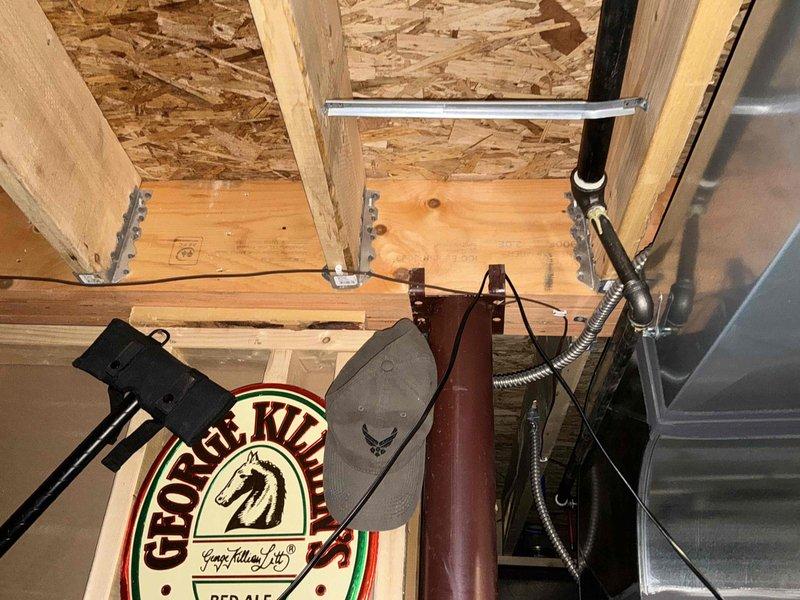 Conducted comprehensive electrical estimate for standby generator installation at residential property. Assessed existing electrical infrastructure, including main service panel and available mounting locations in mechanical space with exposed framing. Documented current electrical distribution system, circuit loading, and panel capacity to determine transfer switch requirements and optimal generator placement. Photographed installation area conditions, including structural framing, available clearances, and proximity to existing HVAC components and utility connections for accurate material takeoff and labor calculations.