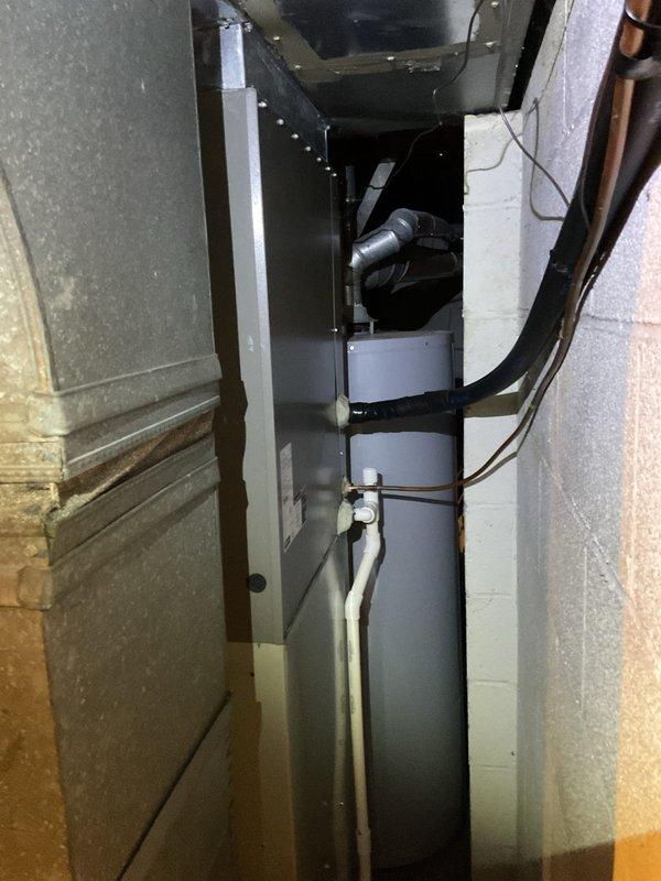Completed MVP recurring cooling maintenance visit on residential HVAC system. Performed comprehensive inspection of air handler unit located in basement utility space and evaporator coil positioned in attic installation. Verified proper operation of all system components including refrigerant lines, condensate drainage, and ductwork connections. Evaporator coil fins were found clean with no visible debris accumulation or damage. All electrical connections, mounting hardware, and insulation were inspected and confirmed secure. System tested and operating within normal parameters.