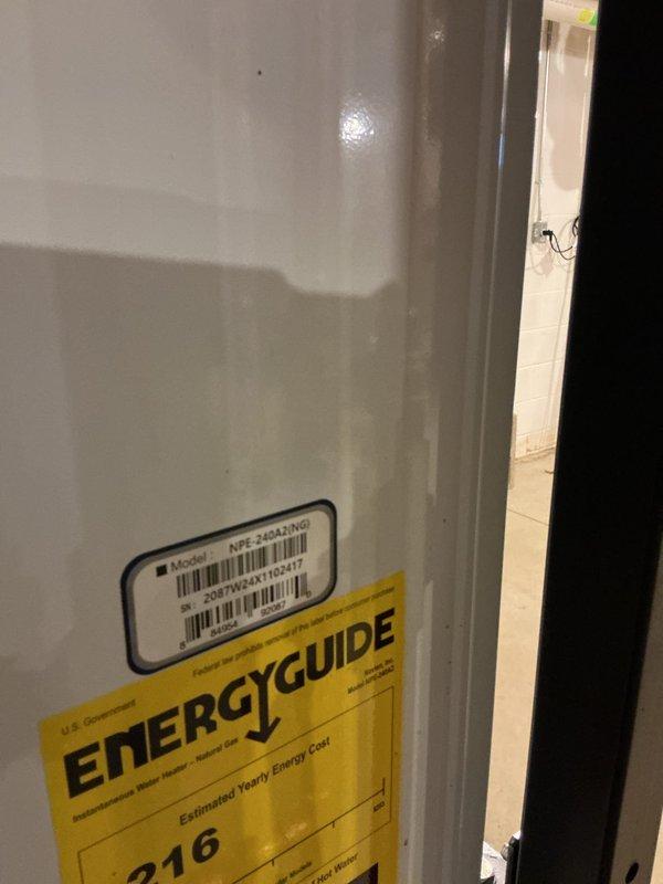 Responded to a service call for a tankless water heater requiring repair at a residential property. Upon arrival, performed diagnostic inspection of the Navien NPE-240A2 tankless unit installed in the basement mechanical room. Assessed the unit's operational status, inspected copper supply and return piping connections, verified proper venting configuration, and examined mounting and support systems. Documented existing conditions of the tankless water heater installation and surrounding mechanical systems for service records.