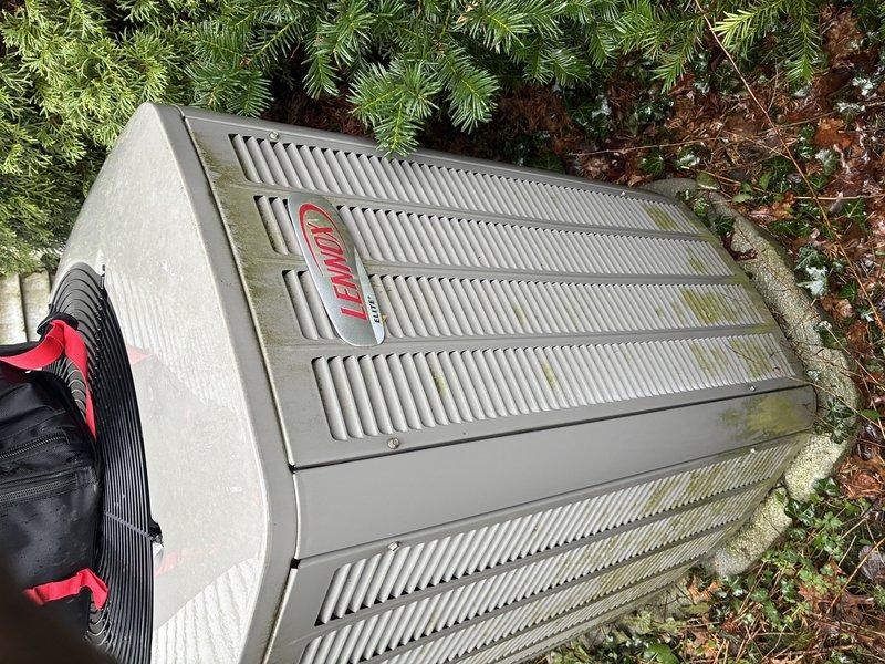 Completed MVP cooling maintenance visit on Lennox outdoor condensing unit. Performed standard inspection of electrical components including capacitor and wiring connections, examined unit exterior condition noting weathering and algae growth on louver panels. Unit operational with no immediate service requirements identified during routine preventive maintenance check.