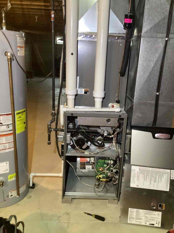 Completed comprehensive AC tune-up on residential split system, including inspection of indoor furnace/air handler unit and outdoor condensing unit. Performed standard maintenance procedures including electrical component testing, refrigerant line inspection, and system safety checks. Customer reported issue with humidifier cover panel repeatedly detaching; noted for follow-up assessment and repair.
