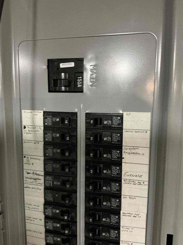 Conducted comprehensive electrical estimate for generator installation at residential property. Performed detailed assessment of existing main electrical panel, documenting current breaker configuration, available capacity, and circuit distribution across two columns of breakers. Photographed panel interior and exterior to evaluate compatibility with proposed generator transfer switch integration. Reviewed circuit labeling and main breaker specifications to determine optimal connection point for automatic transfer switch. Assessment confirmed panel accessibility and structural mounting requirements for future generator system installation.