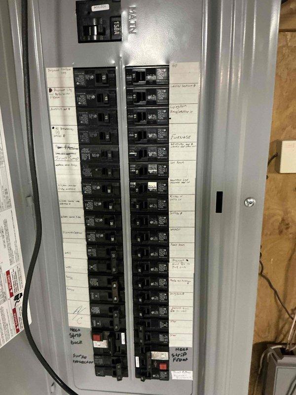 Conducted comprehensive electrical estimate for generator installation at residential property. Performed detailed assessment of existing main electrical panel, documenting current breaker configuration, available capacity, and circuit distribution across two columns of breakers. Photographed panel interior and exterior to evaluate compatibility with proposed generator transfer switch integration. Reviewed circuit labeling and main breaker specifications to determine optimal connection point for automatic transfer switch. Assessment confirmed panel accessibility and structural mounting requirements for future generator system installation.