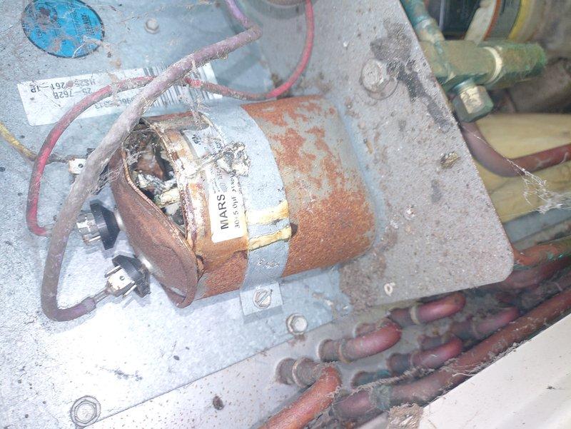 Responded to service call for air conditioning unit not cooling to temperature and fan producing humming noise. Upon inspection, found heavily corroded contactor assembly with deteriorated electrical connections and rust-damaged relay components affecting compressor operation. Identified failed contactor preventing proper electrical supply to outdoor unit, causing system malfunction. Replaced defective contactor assembly, cleaned electrical connections, and verified proper voltage delivery to compressor and condenser fan motor. System tested and confirmed operational with normal cooling cycle restored.