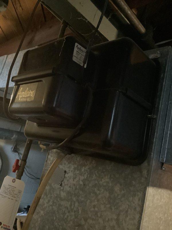 Conducted comprehensive on-site assessment of existing heating system and evaluated property for new air conditioning installation. Documented current furnace configuration in basement mechanical room, including existing Aprilaire humidification equipment, ductwork layout, and available utility connections. Evaluated interior duct chase routing from basement through living space to determine optimal equipment placement and sizing requirements for complete HVAC system replacement with added cooling capacity.