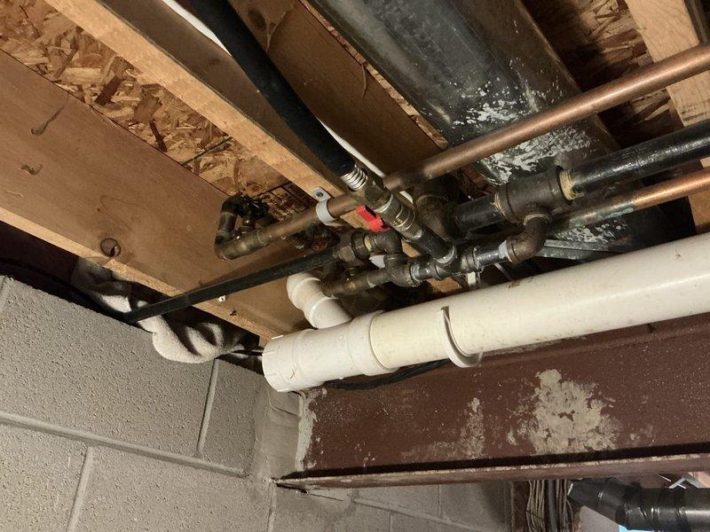 Conducted comprehensive electrical estimate for standby generator installation at residential property. Performed detailed site assessment of existing electrical infrastructure, including evaluation of main electrical panel with dual columns of circuit breakers and current load distribution. Documented mechanical systems routing through unfinished basement area, identifying optimal pathways for generator transfer switch installation and electrical connections. Assessed available space for generator placement, considering proximity to existing gas lines, plumbing infrastructure, and HVAC ductwork. Evaluated foundation wall mounting locations and determined electrical service capacity for integration of automatic transfer switch. Photographed existing panel configuration and mechanical room layout to develop accurate material list and labor requirements for proposed generator system installation.