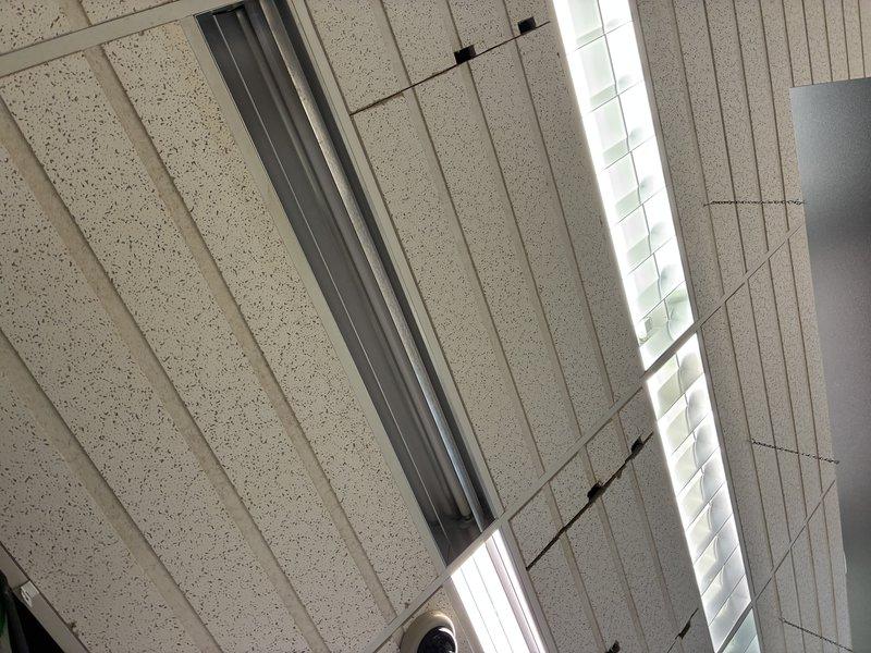 Responded to service call for light fixture and bulb replacement in multiple locations throughout the facility. Successfully replaced non-functioning fluorescent tubes in ceiling-mounted fixtures located in the hallway and backroom areas, as well as fixtures positioned over the register and cooler door. All replaced lamps were tested for proper operation and illumination levels verified before completion.