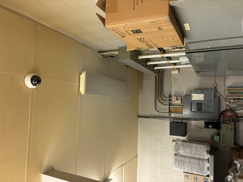 Responded to service call for light fixture and bulb replacement in multiple locations throughout the facility. Successfully replaced non-functioning fluorescent tubes in ceiling-mounted fixtures located in the hallway and backroom areas, as well as fixtures positioned over the register and cooler door. All replaced lamps were tested for proper operation and illumination levels verified before completion.