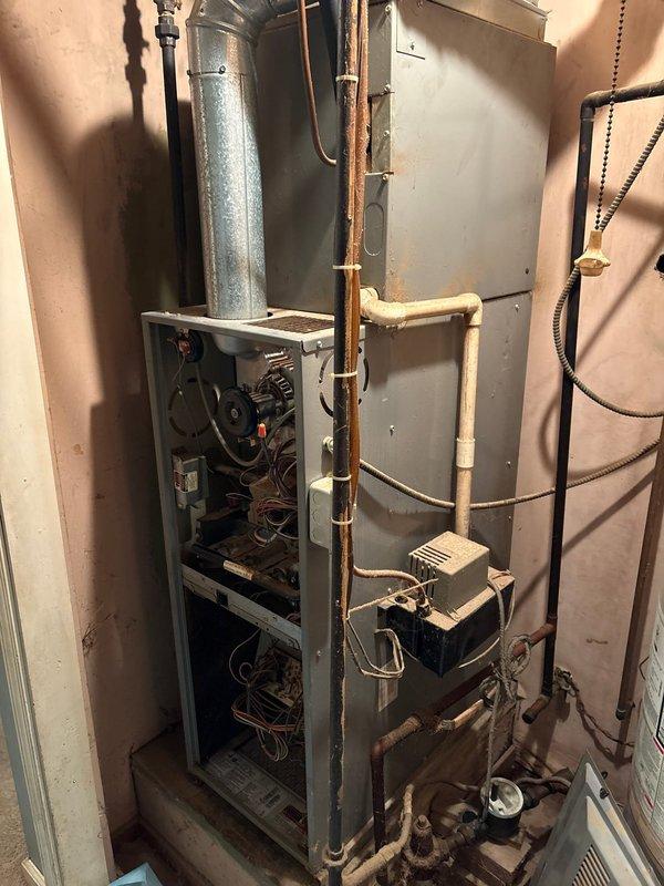 Completed full HVAC system installation including 80% AFUE gas furnace with associated ductwork, electrical connections, and refrigerant line sets. Installed and configured all necessary components including blower motor assembly, gas line connections, condensate drain system, copper refrigerant piping, and electrical service with dedicated circuit. System tested and verified operational with proper airflow and safety controls functioning as designed.