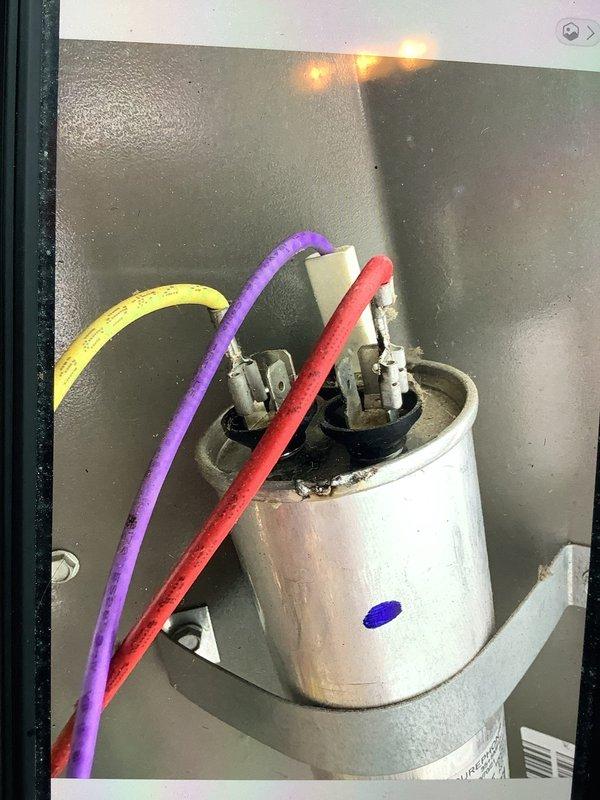 Responded to no cooling complaint on four-year-old residential air conditioning system. Upon arrival, performed complete system diagnostics using digital manifold gauges and temperature probes. Found system operating with suction pressure of 108.0 psi and discharge pressure of 145.2 psi on R410A refrigerant. Measured suction line temperature at 54.0°F with corresponding saturation temperature of 35.3°F, indicating superheat of 18.7°F. Liquid line temperature measured 43.6°F with saturation temperature of 50.8°F, showing subcooling of 7.2°F. Inspected dual run capacitor which showed signs of age and weathering. System readings indicated potential low refrigerant charge or airflow restriction affecting cooling performance. Documented all pressure and temperature readings for service records and provided recommendations for restoring optimal system performance.