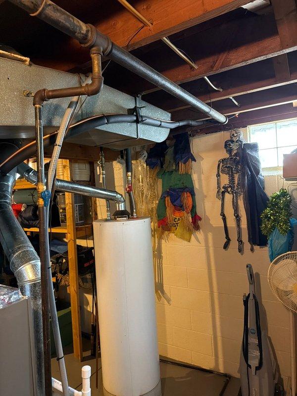 Completed installation of new air conditioning evaporator coil on existing furnace system in residential basement. Unit was properly mounted, refrigerant lines connected, condensate drain plumbing installed with pump system, and all ductwork transitions sealed and secured. System tested and confirmed operational with proper airflow and drainage.